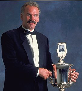 Joel Quenneville with the Jack Adams trophy