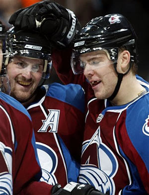 Hejduk and Stastny celebrate Hejduk's hat trick against the Blues